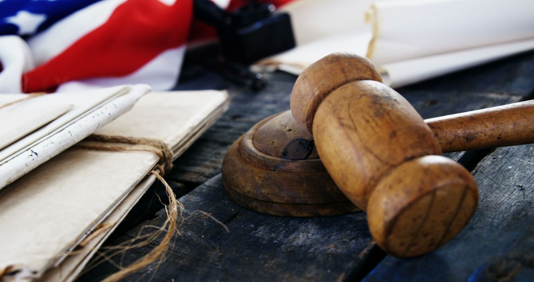 The display of a gavel, flag, and documents epitomizes the tradition of American justice. - Free Images, Stock Photos and Pictures on Pikwizard.com