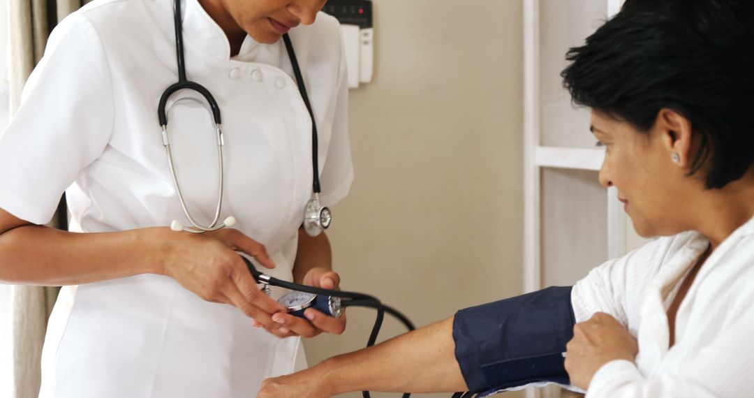 Nurse Checking Woman's Blood Pressure - Free Images, Stock Photos and Pictures on Pikwizard.com