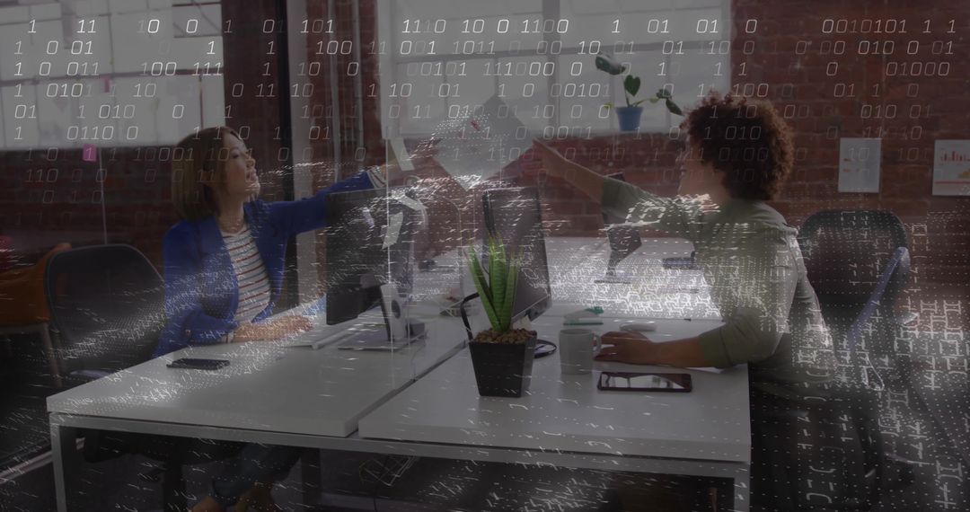 Fist Bumping Colleagues Celebrating Success in Modern Office