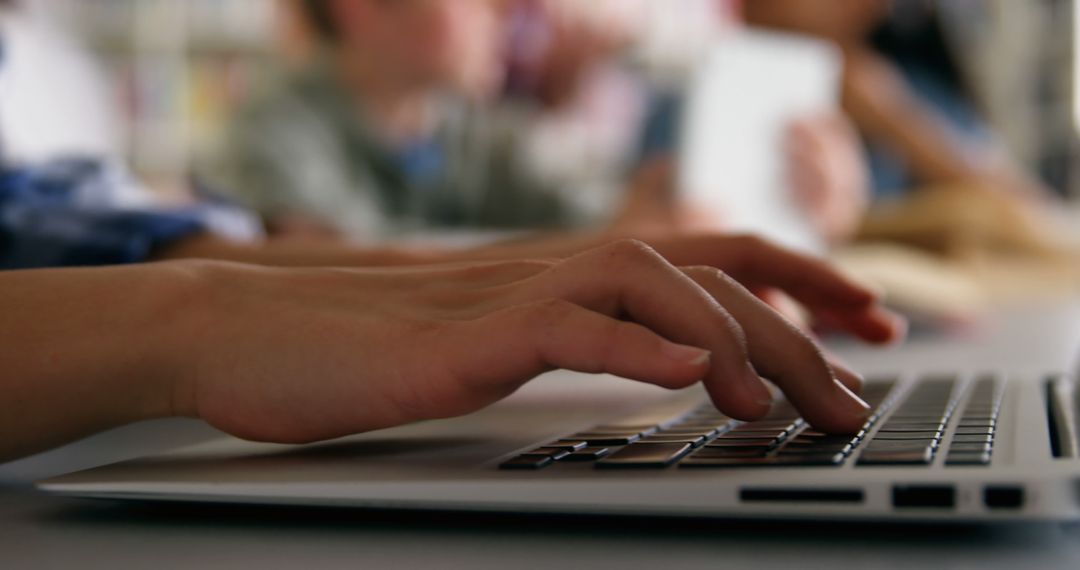 Student Typing on Laptop Keyboard with Blurred Classroom Background - Free Images, Stock Photos and Pictures on Pikwizard.com