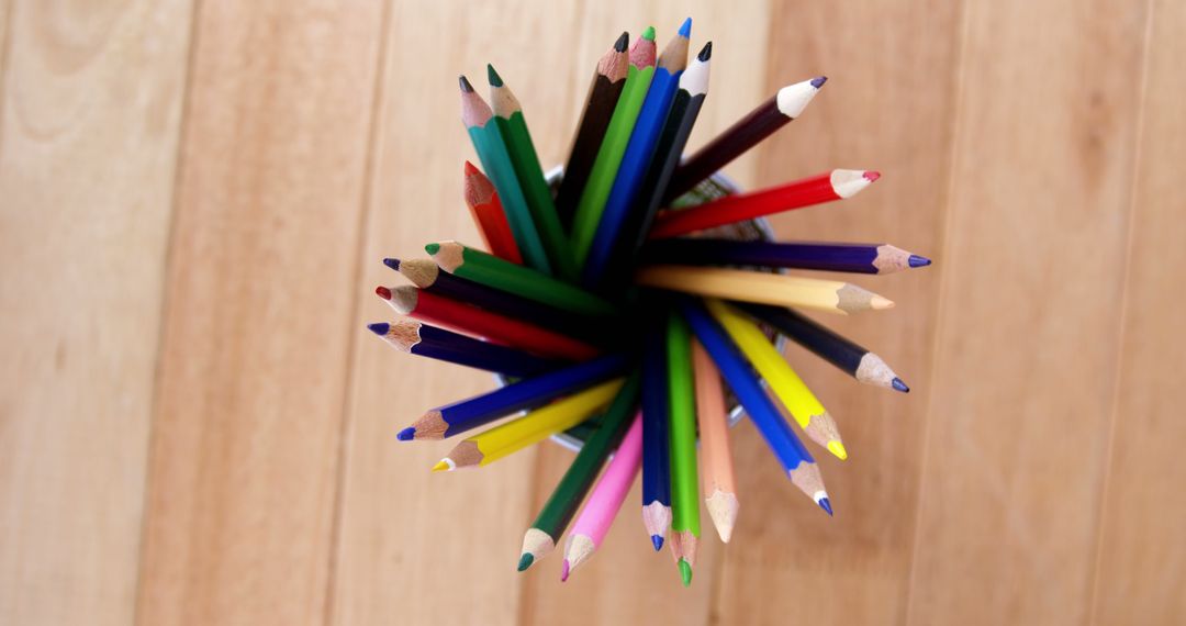 Colored Pencils in Container Viewed from Above on Wooden Surface - Free Images, Stock Photos and Pictures on Pikwizard.com