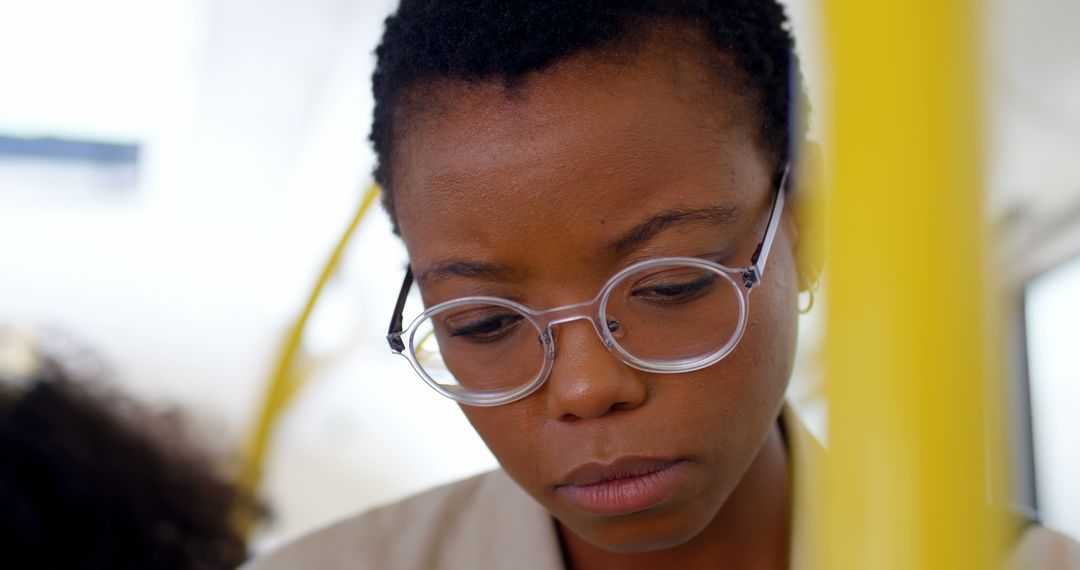 Thoughtful Black Woman with Eyeglasses Deep in Focus - Free Images, Stock Photos and Pictures on Pikwizard.com