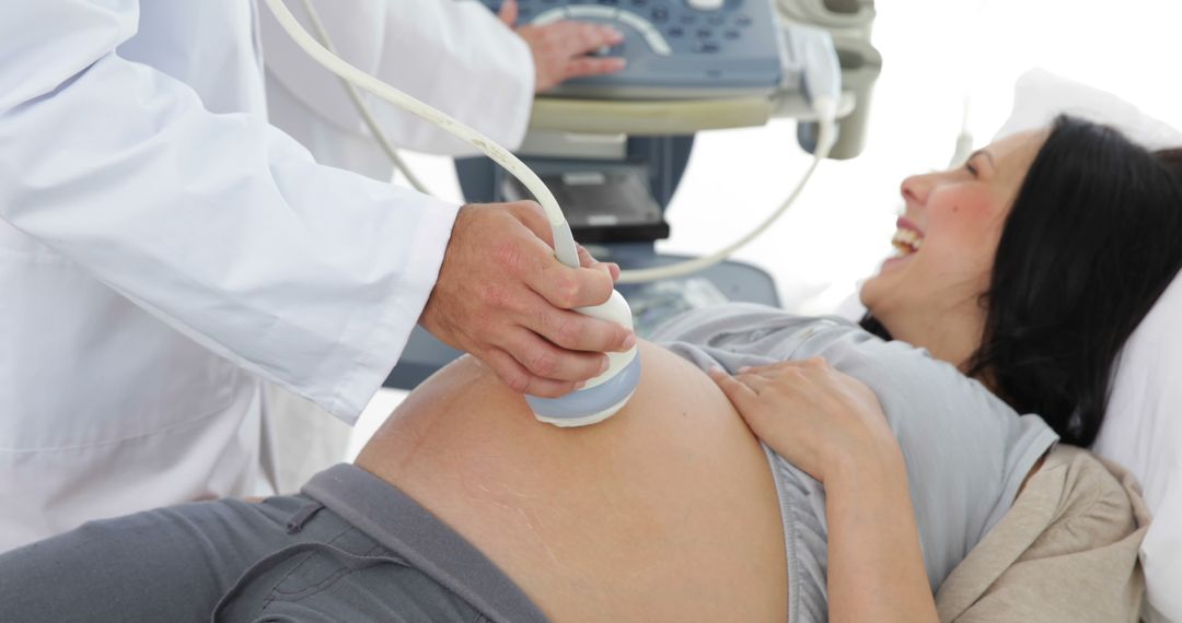 Pregnant Woman Receiving Ultrasound Examination at the Clinic - Free Images, Stock Photos and Pictures on Pikwizard.com