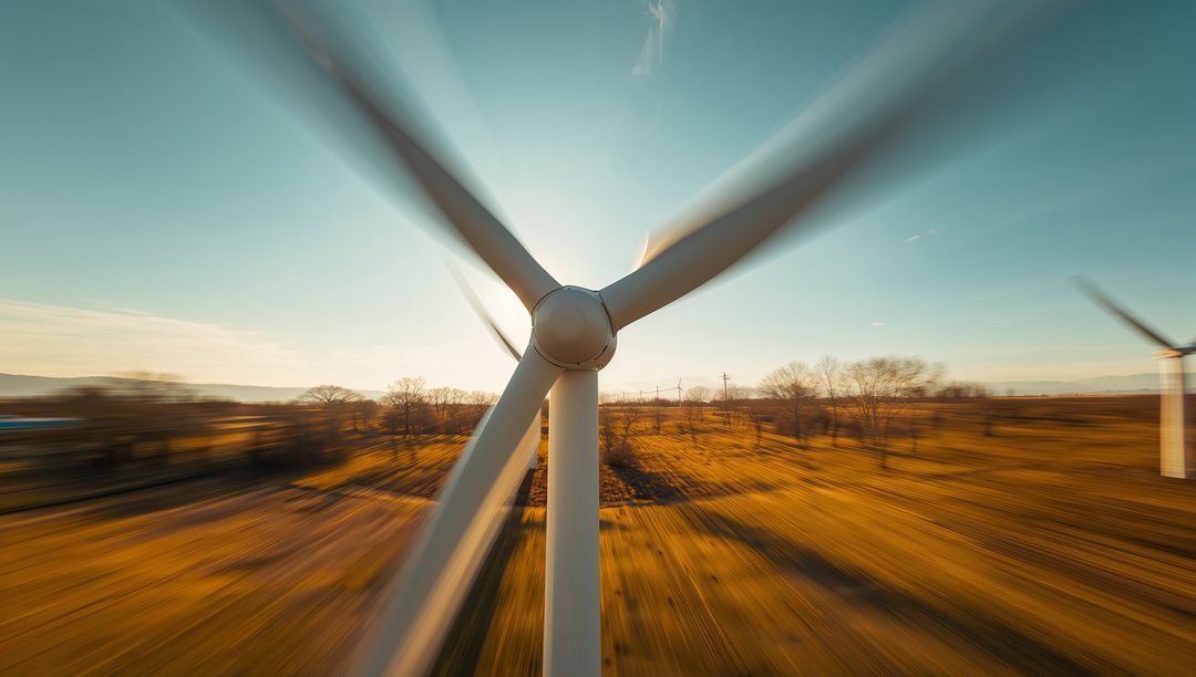 Dynamic Wind Turbine Spinning Against Golden Field