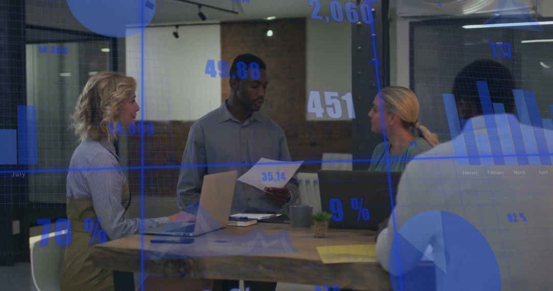 Diverse Team Analyzing Data Graphics in Modern Office