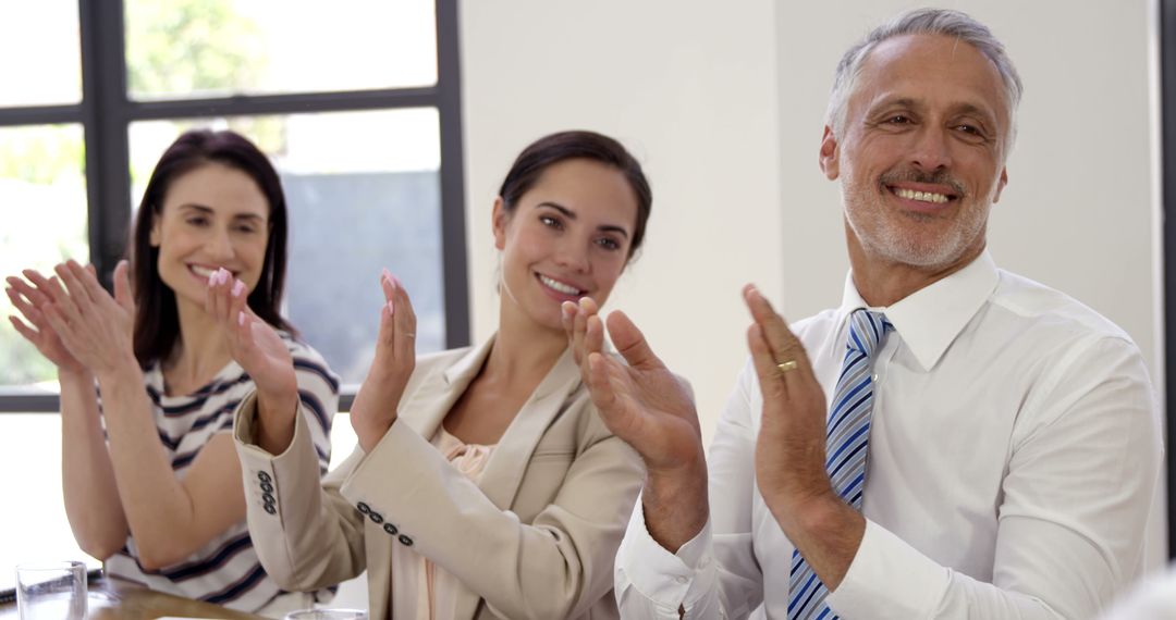 Business Colleagues Applauding at Corporate Meeting - Free Images, Stock Photos and Pictures on Pikwizard.com