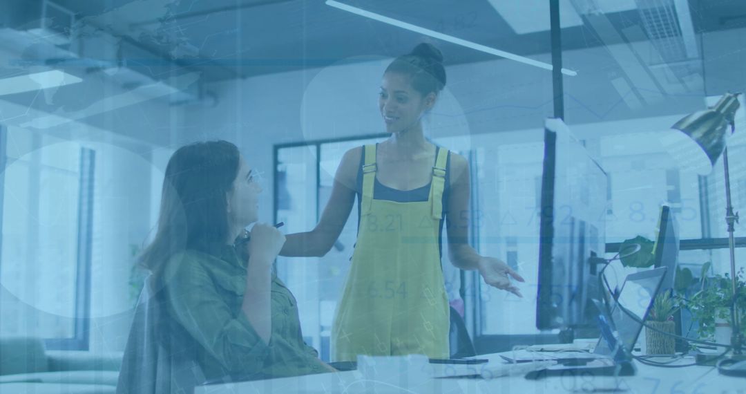 Diverse Colleagues Collaborating in Modern Office Overlaid with Financial Data