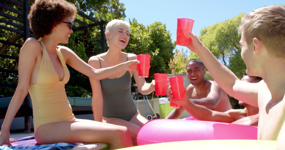 Group of Friends Enjoying a Pool Party with Red Cups - Free Images, Stock Photos and Pictures on Pikwizard.com