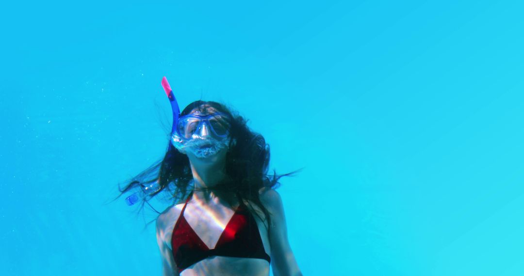 Young woman snorkeling underwater in red bikini - Free Images, Stock Photos and Pictures on Pikwizard.com