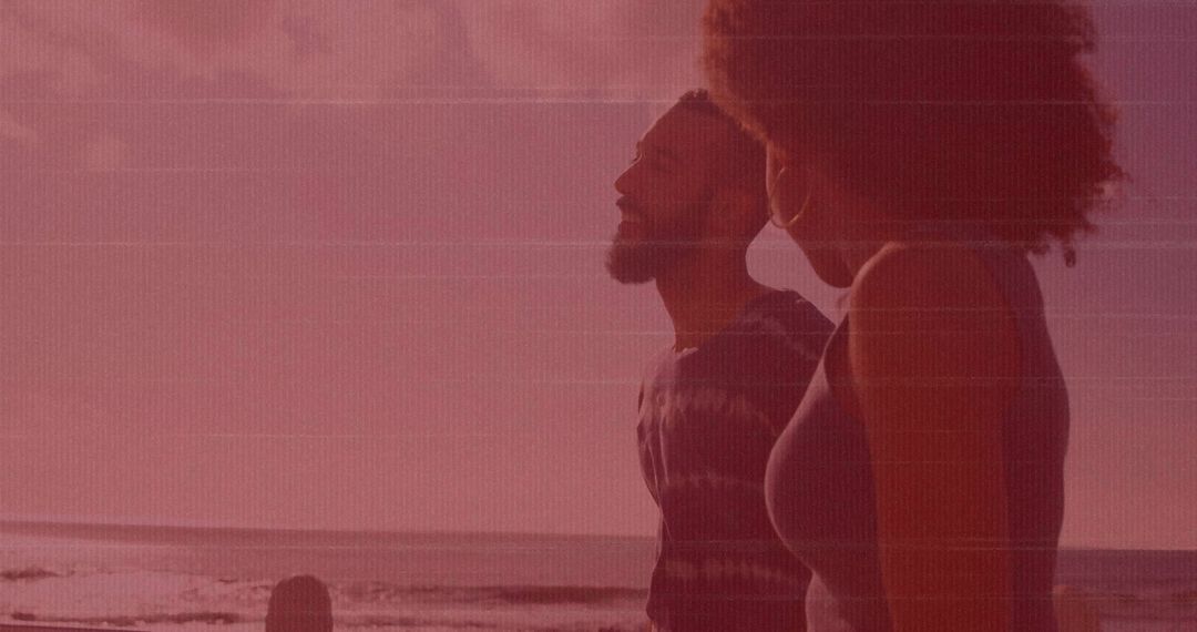 Couple Strolling Beachfront at Sunset with Serene Vibes