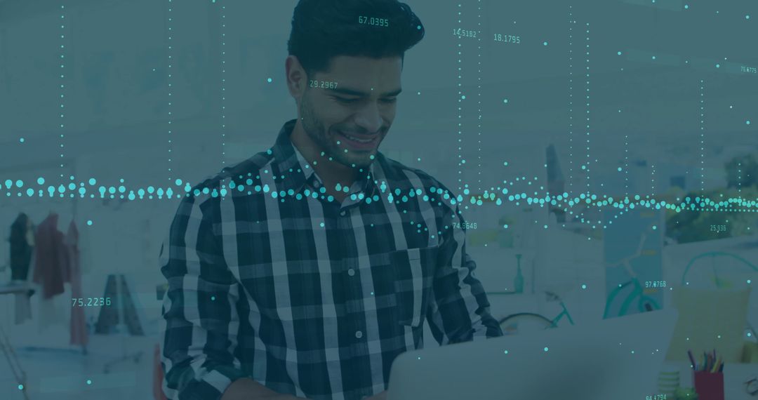 Businessman Using Laptop with Financial Data Overlay