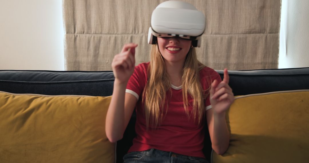 Teenage Girl Enjoying Virtual Reality Game at Home