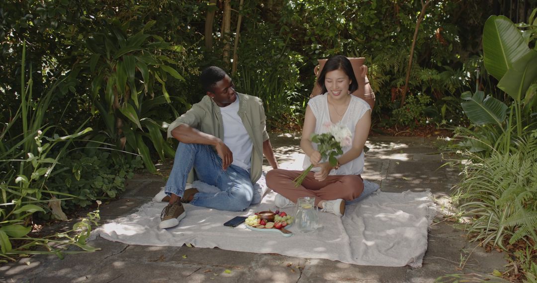 Happy Couple Enjoying Relaxing Picnic Day in Lush Garden