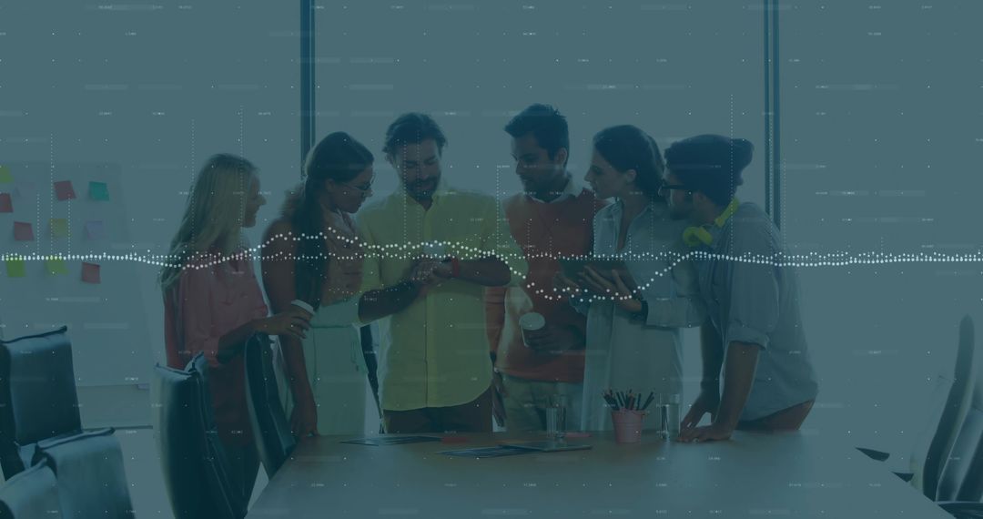 Young team collaborating around smartphone, studying ideas and sharing feedback