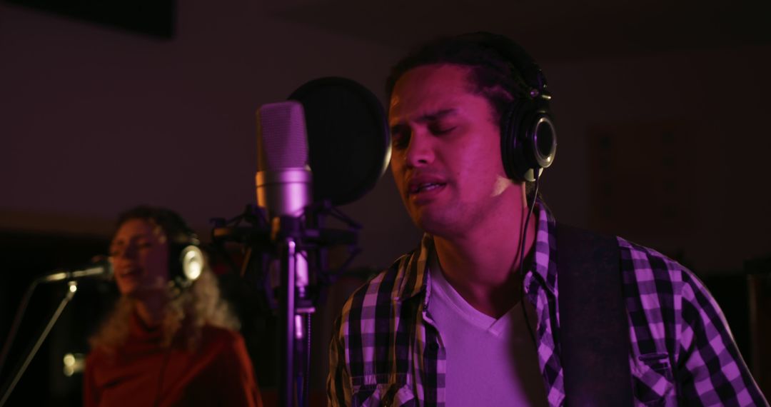 Musician Duo Recording a New Song in Professional Studio