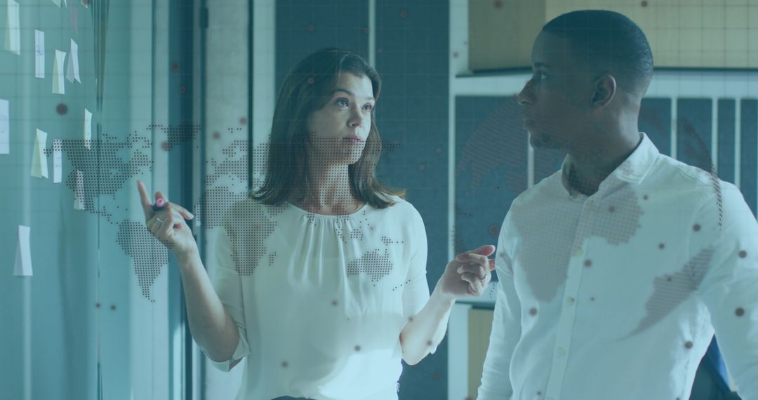 Diverse Colleagues Analyzing Global Business Strategy with Infographic Overlay