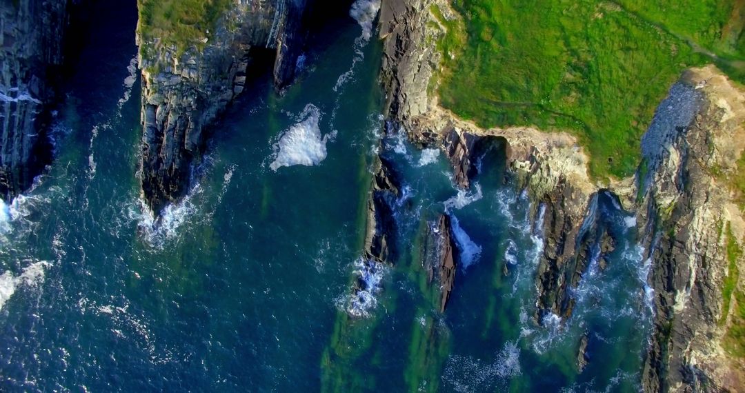 The aerial photo highlights the striking contrast and interplay between the ocean and cliffside. - Free Images, Stock Photos and Pictures on Pikwizard.com