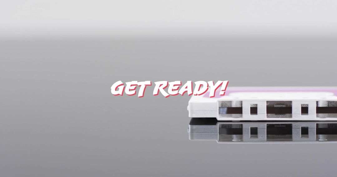 Retro Cassette Tape with Get Ready Text on Reflective Surface
