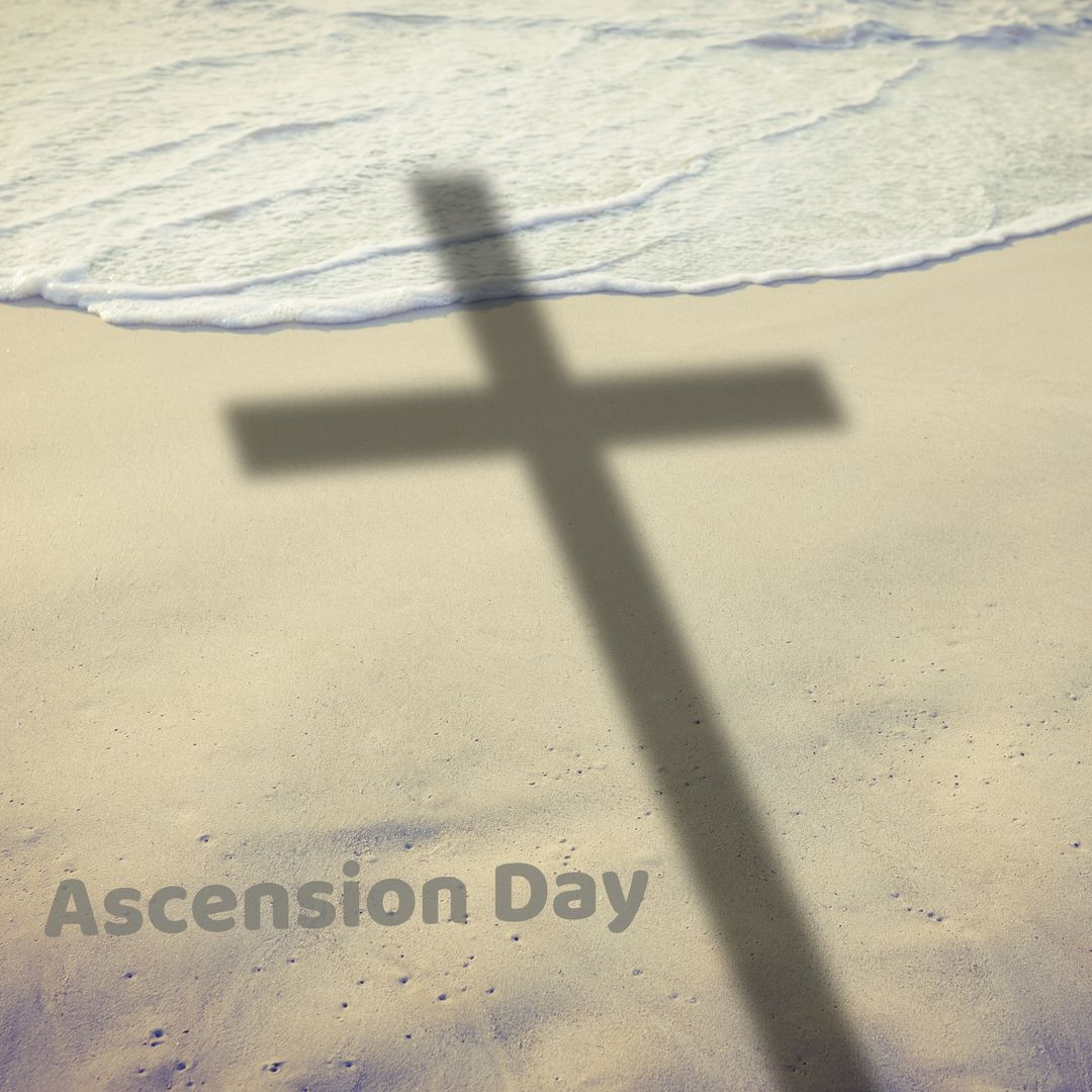 Shadow of Cross on Serene Beach Symbolizing Ascension Day