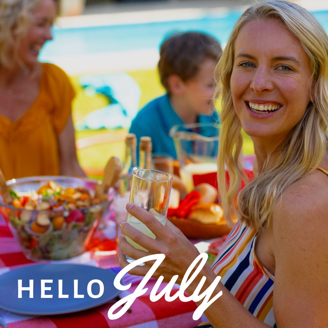 Celebrating July with Family Picnic, Woman Holding Juice and Smiling - Download Free Stock Templates Pikwizard.com