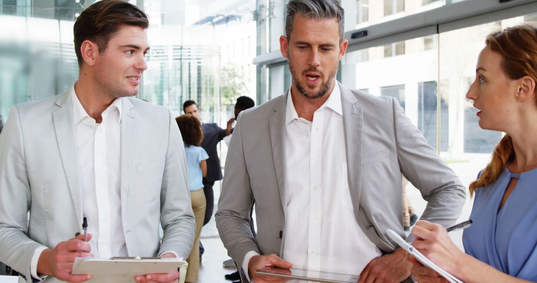 Business Professionals Discussing in Modern Office Environment