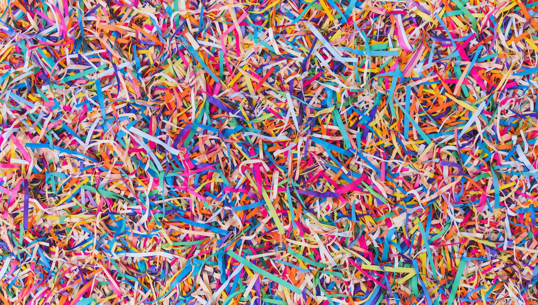 Bursting with Color Confetti Cascade Close-Up Multicolored Shredded Paper Streamers Texture