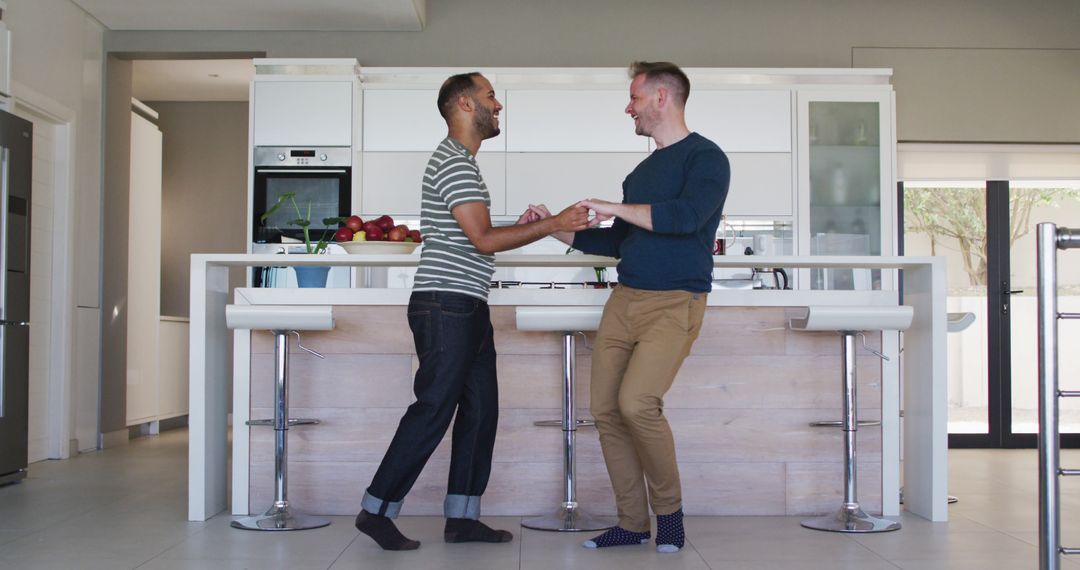 Multicultural Couple Dancing at Home Preparing Meal