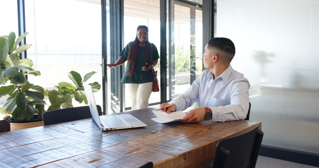 Multiracial Colleagues in Informal Office Meeting