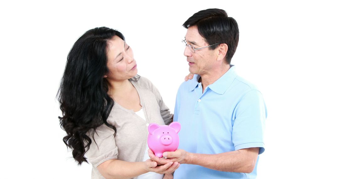 Happy Couple Saving Money with Piggy Bank - Free Images, Stock Photos and Pictures on Pikwizard.com