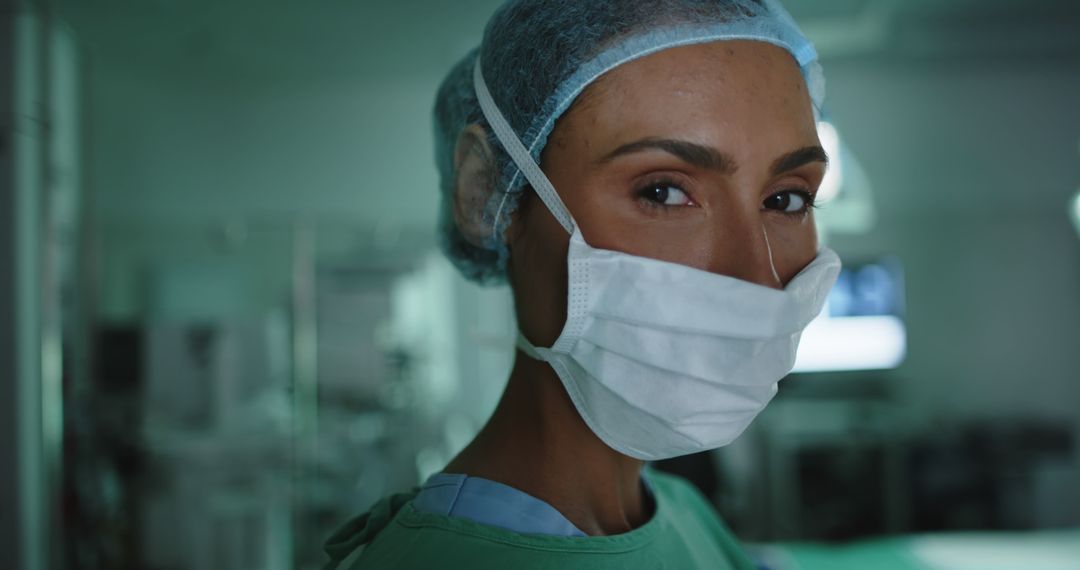 Closeup of Confident Female Surgeon Wearing Surgical Mask in Operating Room - Free Images, Stock Photos and Pictures on Pikwizard.com