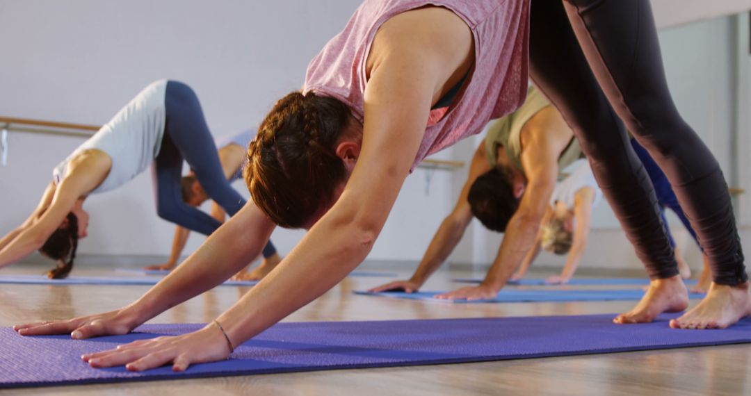 Group Performing Downward Dog in Yoga Class - Free Images, Stock Photos and Pictures on Pikwizard.com