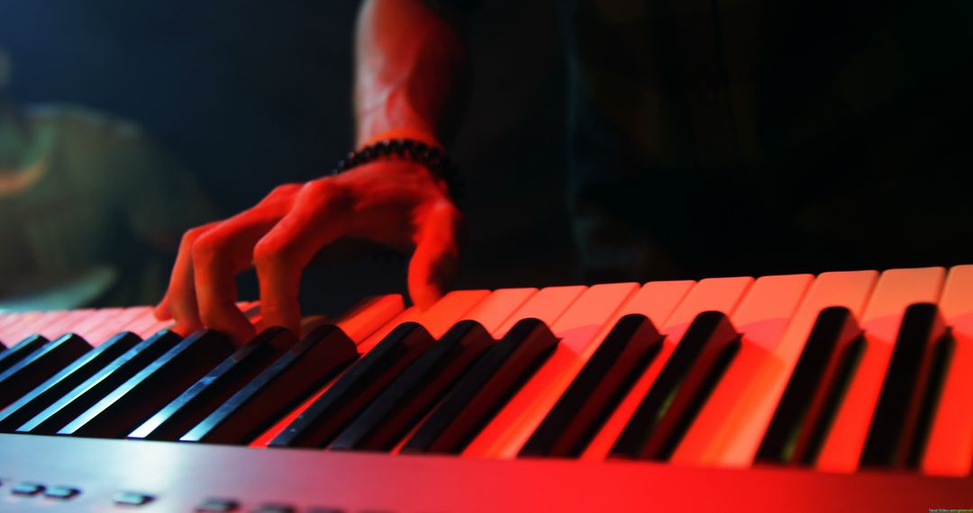 Close-up of Hands Playing the Keyboard under Red Lighting - Free Images, Stock Photos and Pictures on Pikwizard.com