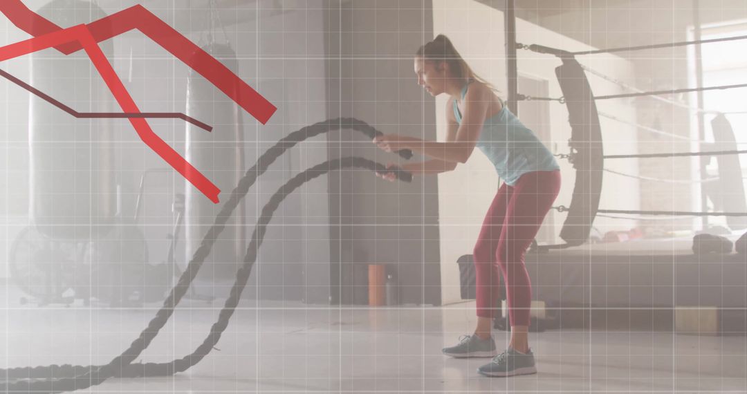 Woman Using Battle Ropes with Declining Graph