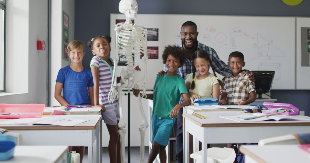 Teachers and Kids Smiling in Classroom with Skeleton Model - Free Images, Stock Photos and Pictures on Pikwizard.com