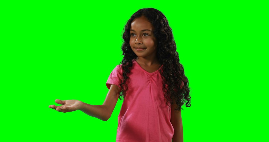 Cheerful Girl Presenting on Green Screen Background - Free Images, Stock Photos and Pictures on Pikwizard.com