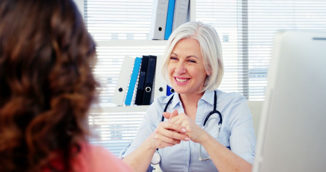 Senior Female Doctor Consulting Patient in Medical Office - Free Images, Stock Photos and Pictures on Pikwizard.com