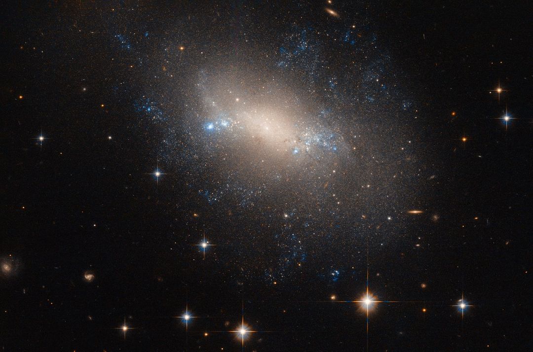Galactic Formation Insights: Irregular Galaxy NGC 2337 in Lynx - Free Images, Stock Photos and Pictures on Pikwizard.com