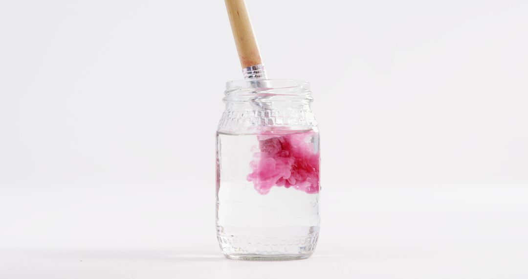 Close-Up of Pink Paint Dissolving in Water Jar - Free Images, Stock Photos and Pictures on Pikwizard.com