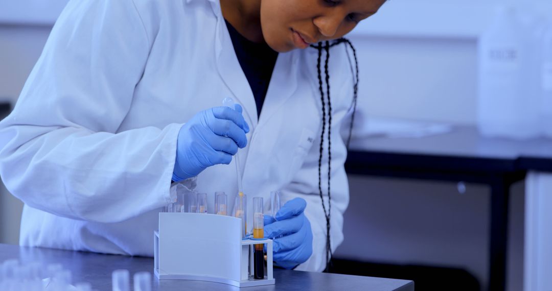 Scientist Conducting Laboratory Research with Test Tubes - Free Images, Stock Photos and Pictures on Pikwizard.com