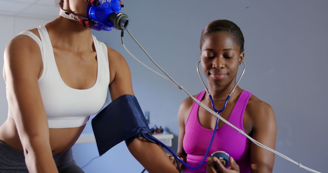 Female Trainer Monitoring Patient During Exercise Stress Test - Free Images, Stock Photos and Pictures on Pikwizard.com