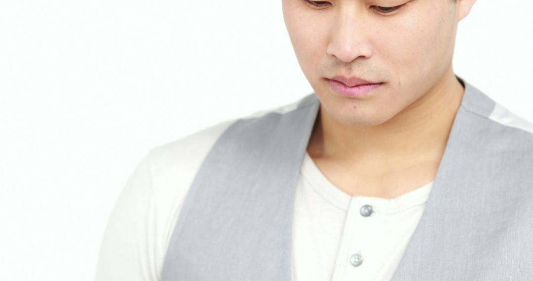 Contemplative Young Man With Neutral Expression and Casual Attire