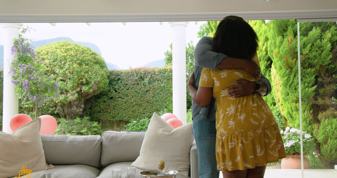 Couple Relaxing and Hugging on Patio with Scenic Garden View