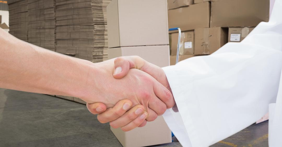 Handshake in Warehouse, Successful Business Agreement - Free Images, Stock Photos and Pictures on Pikwizard.com