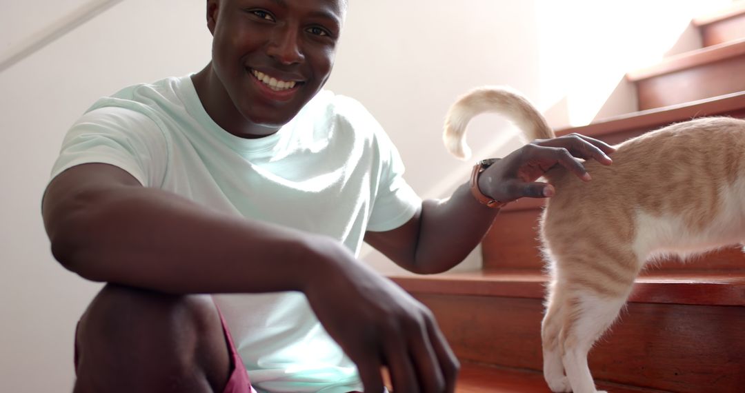 Joyful Bonding with Cat on Wooden Staircase at Home
