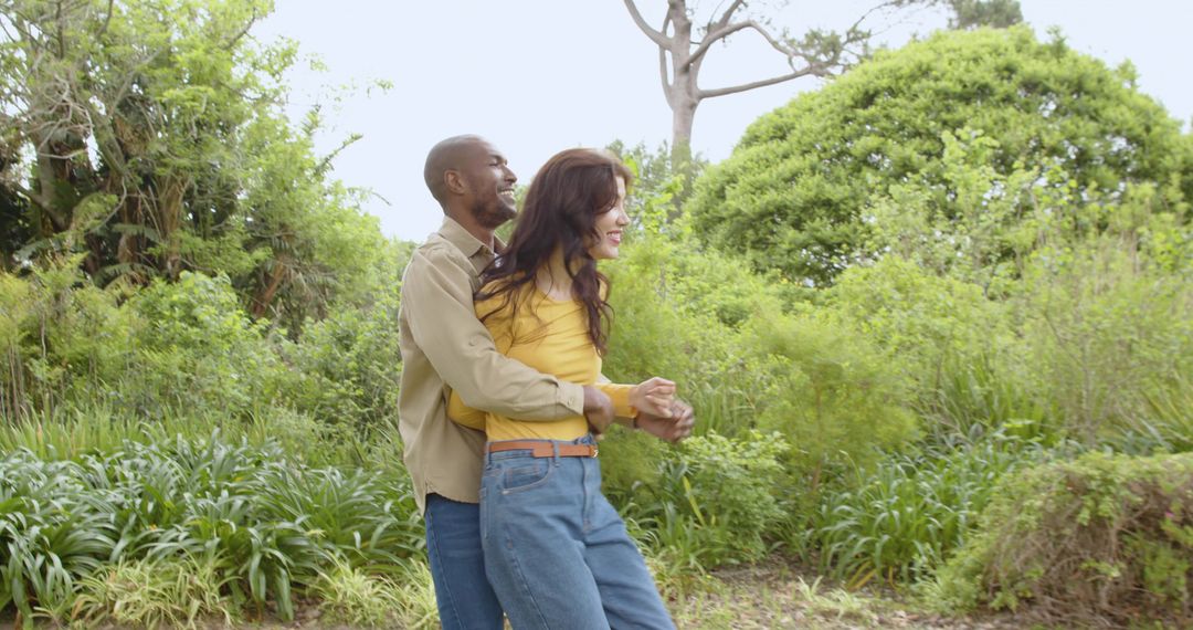 Diverse Couple Embracing in Serene Natural Setting