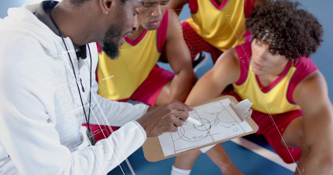 Basketball Coach Discussing Strategy with Team During Practice