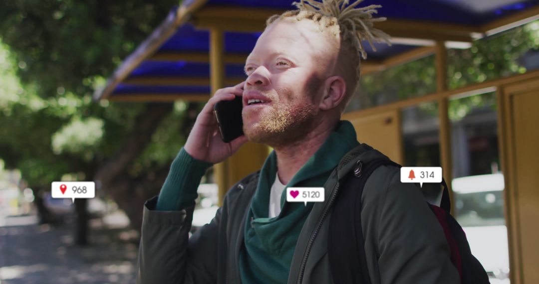 Smiling Man Using Smartphone with Social Media Notifications in Street