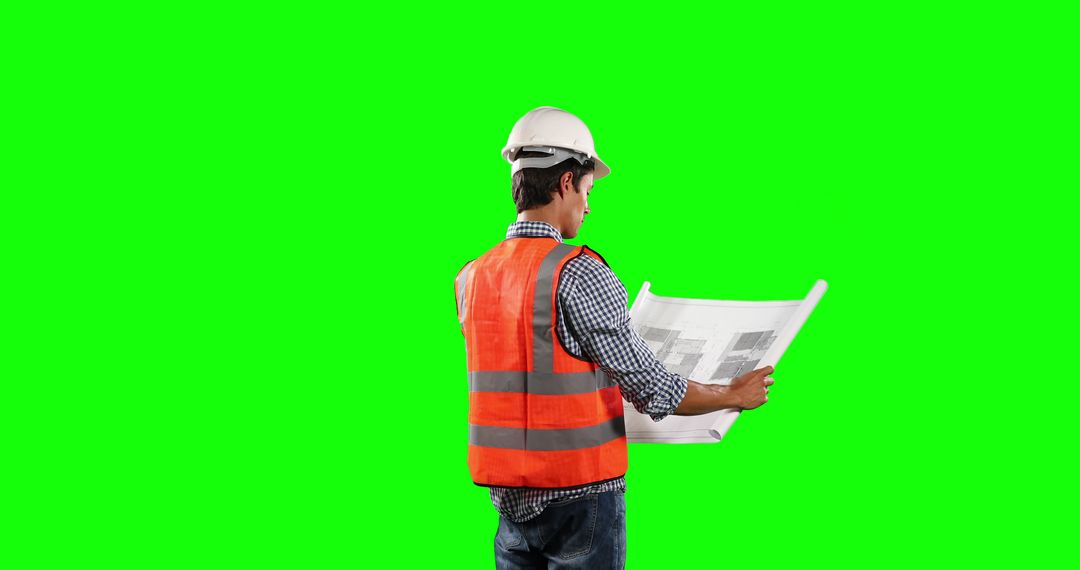 Construction Worker Reading Blueprints on Green Screen Background - Free Images, Stock Photos and Pictures on Pikwizard.com