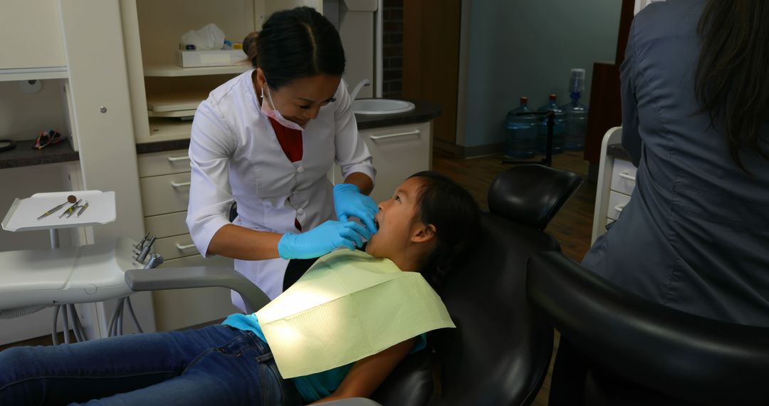 Dentist Treating Young Patient in Modern Clinic - Free Images, Stock Photos and Pictures on Pikwizard.com