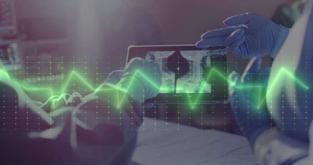 Surgeons Using Digital Tablet with Cardiograph Overlay in Operating Room